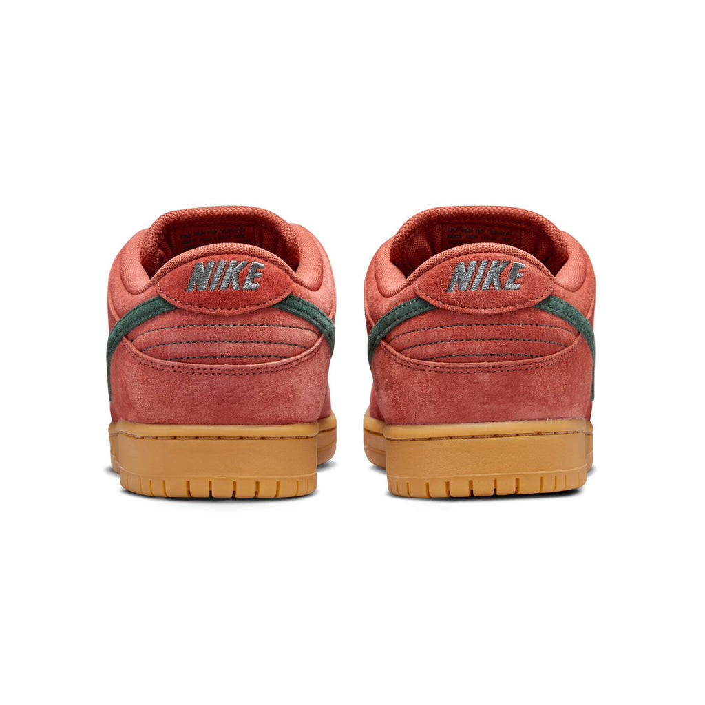 A pair of University Red and green nike NIKE SB DUNK LOW PRO BURNT SUNRISE / VINTAGE GREEN sneakers viewed from the back, featuring "Nike" text on the heel and gum-colored soles, with a comfortable foam midsole.