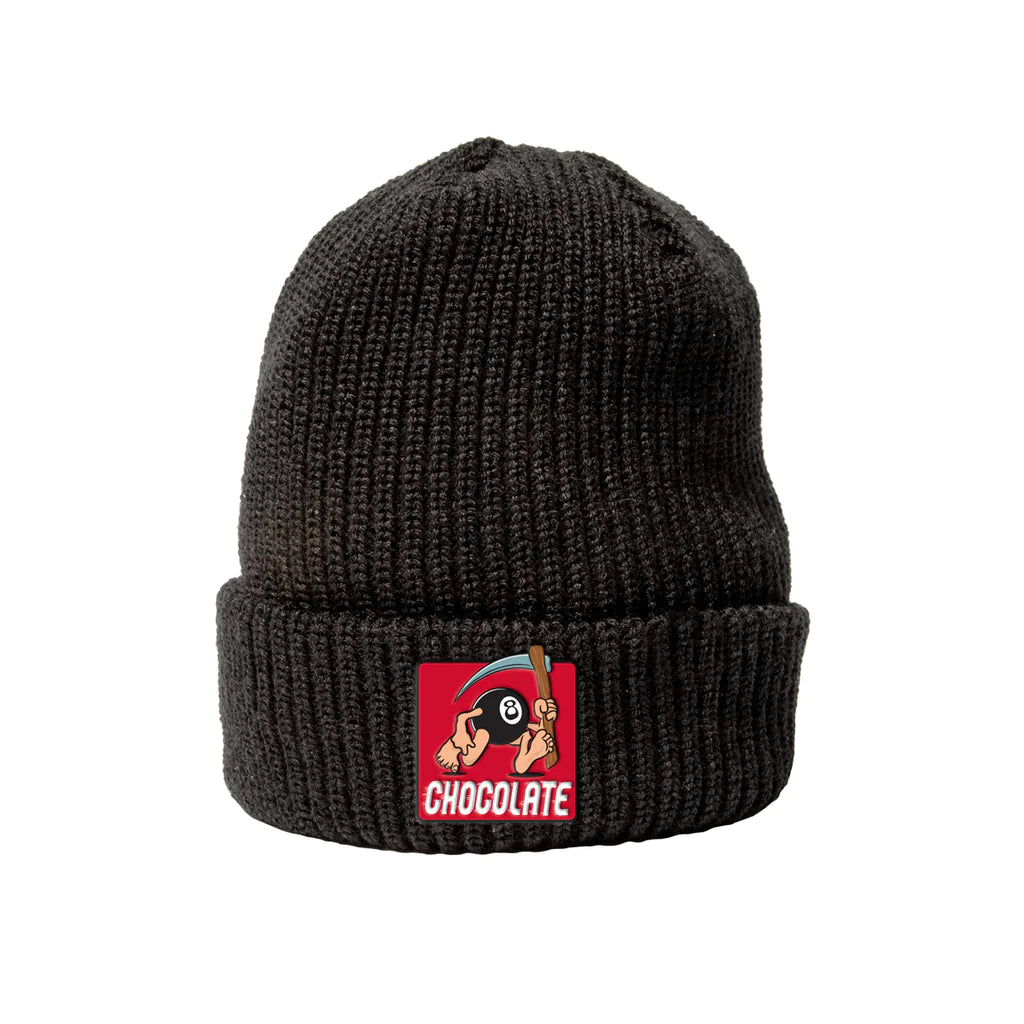 A black CHOCOLATE beanie with the word CHOCOLATE on it.