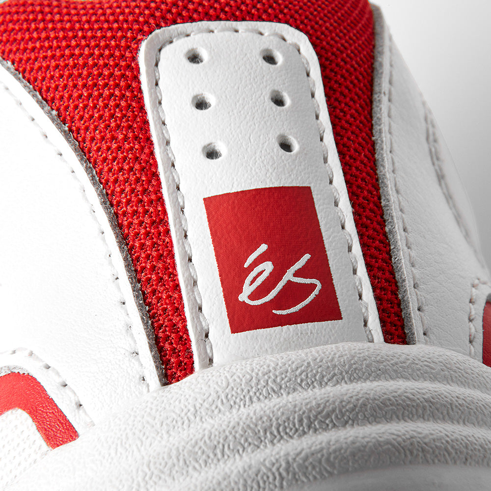 Close-up of the éS TJ ROGERS WHITE / RED sneaker by ES, showing a red logo with white script on the heel, textured red fabric accents, and an E-Bound midsole for impact-resistant comfort.