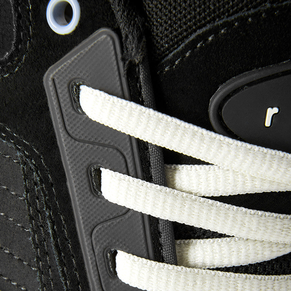 Close-up of the éS TJ ROGERS BLACK / BLUE / WHITE skate shoe by ES, featuring white laces through black eyelets and a classic cupsole inspired by the iconic éS ACCEL.
