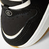 Close-up of the toe area of the ES éS TJ ROGERS BLACK / BLUE / WHITE skate shoe, featuring black suede, white stitching, a white cupsole, and a small 'éS' logo near the laces—showcasing its classic skate style.