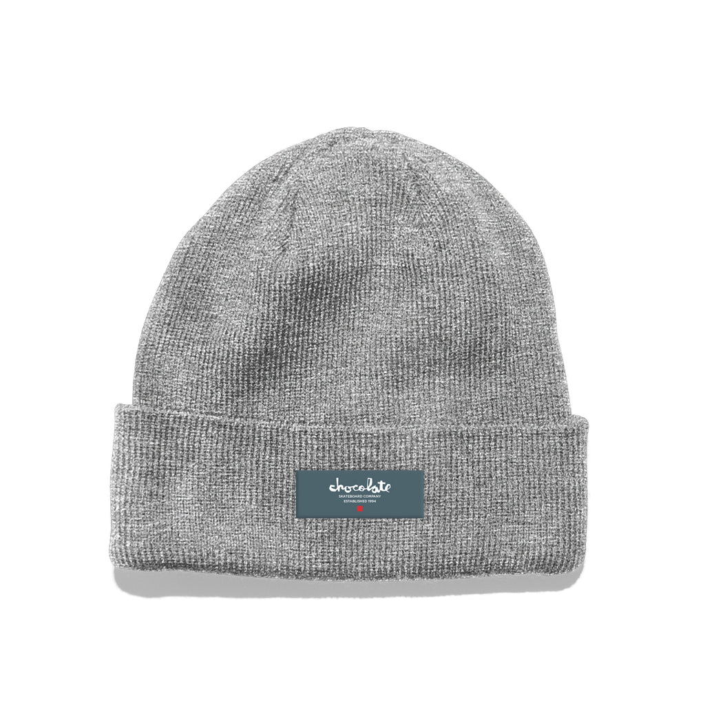 A CHOCOLATE EST. CHUNK BEANIE GREY with a CHOCOLATE logo on it.