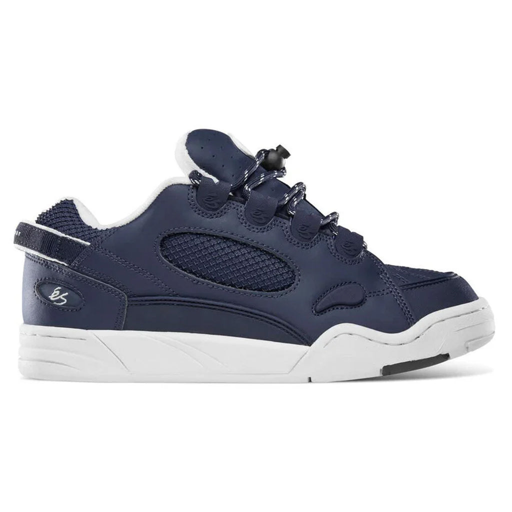 The ÉS THE MUSKA NAVY / WHITE by ES is a navy and white athletic shoe with a chunky sole, mesh panels, and bungee-style laces, inspired by the iconic éS Muska. This limited edition is perfect for skateboarding fans seeking style and functionality.