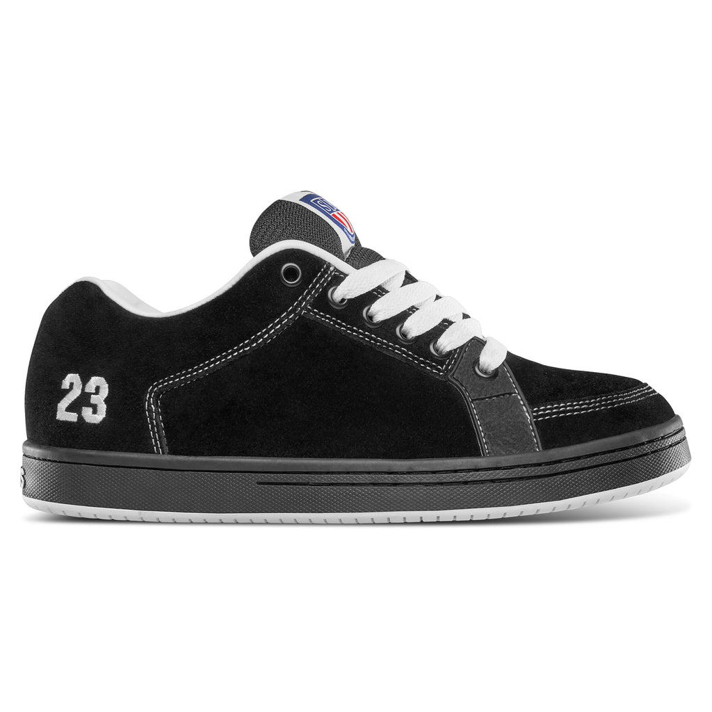 The ETNIES SAL 23 BLACK / WHITE shoe from ETNIES showcases a classic black design with white laces, featuring the number "23" in white on the heel and a patterned sole, embodying Salvador "Sal" Barbier's signature style.