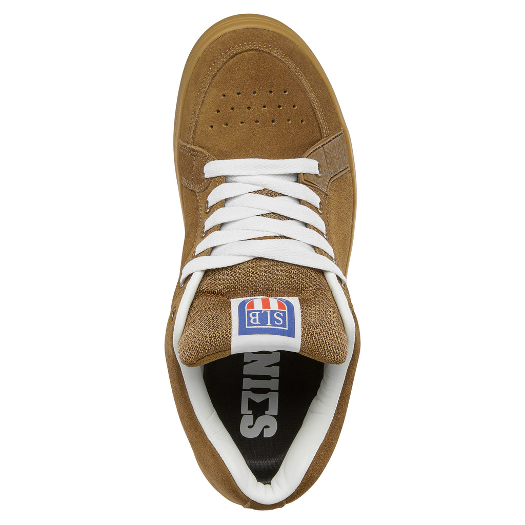 The ETNIES SAL 23 BROWN / GUM sneaker showcases a suede upper in brown with white laces and a gum sole, reflecting the design principles celebrated by Salvador Barbier. Its top view resonates with influences from classic Etnies skate shoes.