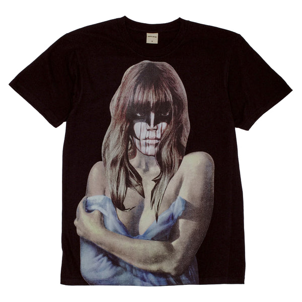 The FUCKING AWESOME LAST NIGHT TEE BLACK is a black T-shirt made from 100% cotton, featuring a graphic print of a woman with long hair, partially draped in a blue cloth, with a skeletal face.