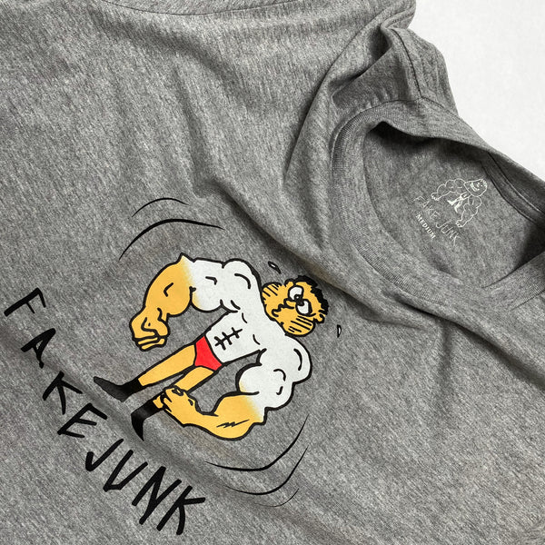 A FAKE JUNK TAN LINES T-SHIRT GREY with a cartoon character on it.