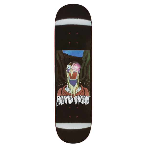 A black FUCKING AWESOME K.B. SHINJUKU skateboard deck featuring a digital print graphic of THE COMEDIAN with an open mouth and glowing eye. The text "Fucking Awesome" is printed boldly below the image.