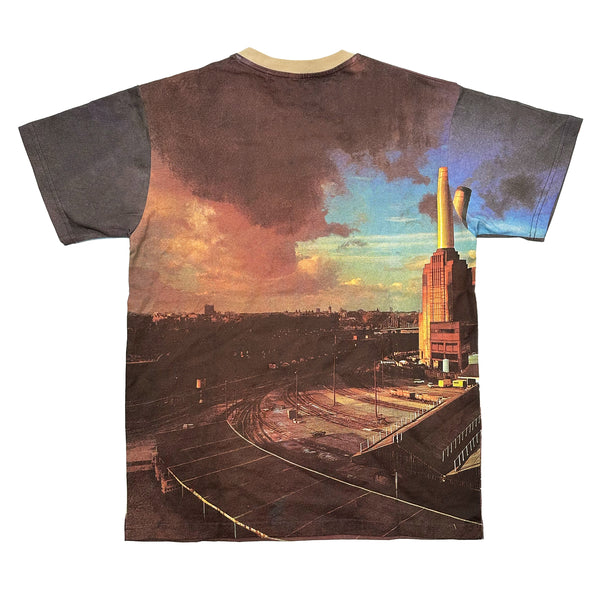 HABITAT HABITAT X PINK FLOYD ANIMALS TEE featuring an artistic print of an industrial landscape with smoke stacks and rail tracks under a dramatic sky, reminiscent of Pink Floyd's "Wish You Were Here" album cover.