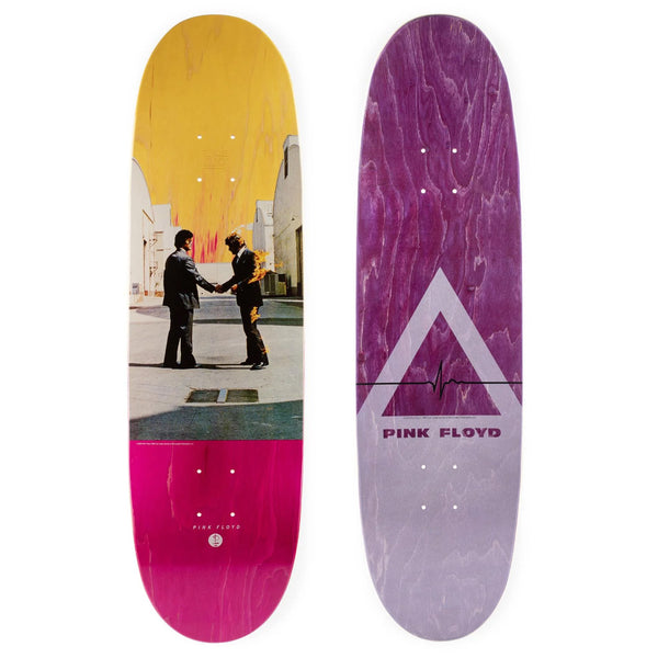 Two Habitat X Pink Floyd Wish You Were Here Shaped skateboards with artistic designs, one featuring the 'wish you were here' handshake image, and the other with a dark marbled background and band logo.