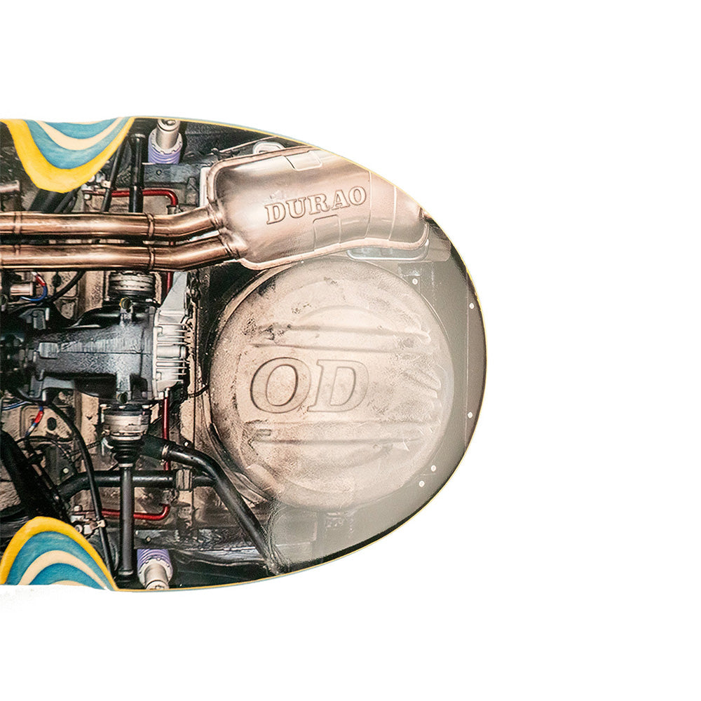 Close-up of the HARDBODY DURAO CAR UNDERNEATH 8.375" skateboard deck by HARDBODY, featuring artwork of a car’s undercarriage with visible exhaust, pipes, and mechanical parts; 14.375" wheelbase.