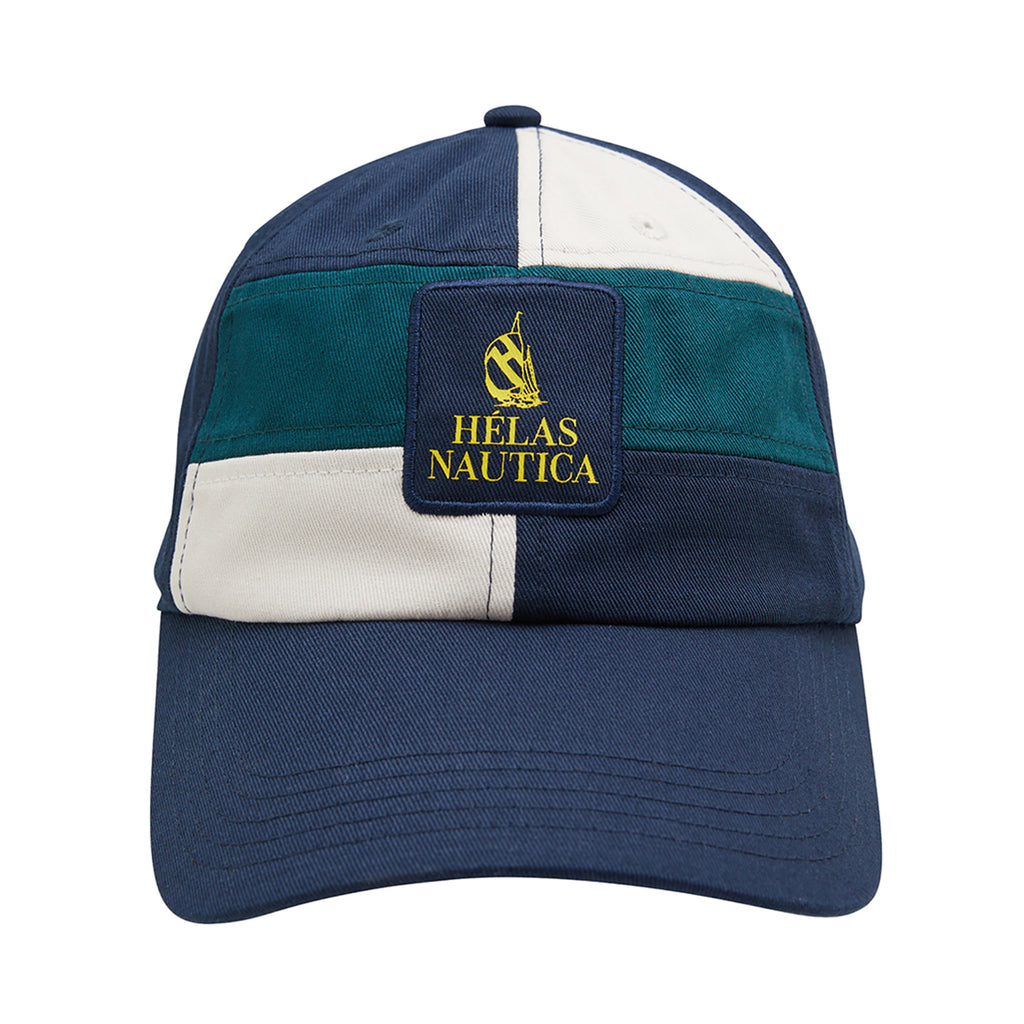 The HELAS X NAUTICA AUBERT STRAPBACK CAP in dark navy features color-blocked panels in green and white, along with a "Nautica x Helas" logo and a yellow sailing boat on the front.