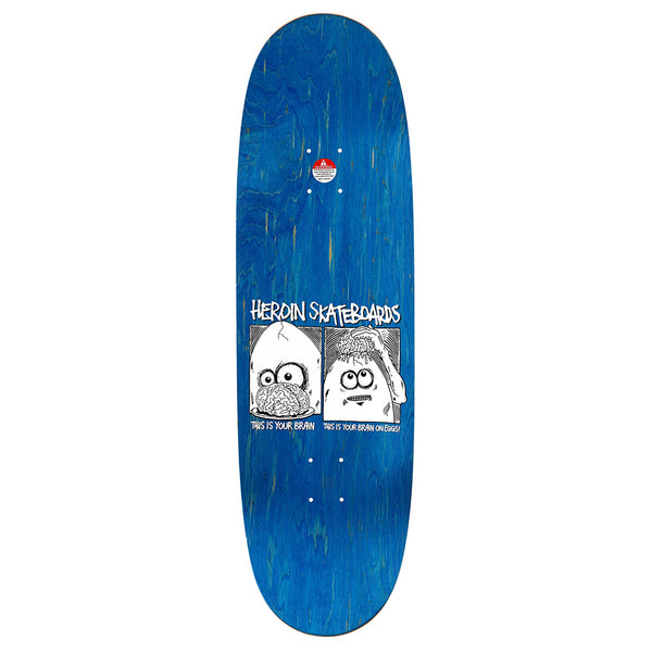 The HEROIN BRAIN ON EGGS skateboard deck by HEROIN features a blue North American Hard Rock Maple build with a black-and-white cartoon and "This is your brain"/"This is your brain on heroin" text.