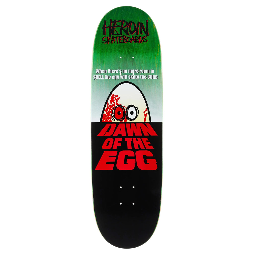 The HEROIN DAWN OF THE EGG 9.4" skateboard deck by HEROIN features a green-to-black gradient, a one-eyed cartoon egg with "DAWN OF THE EGG," and logo at the top. Crafted from hard rock maple for true Heroin Curb Killer style.