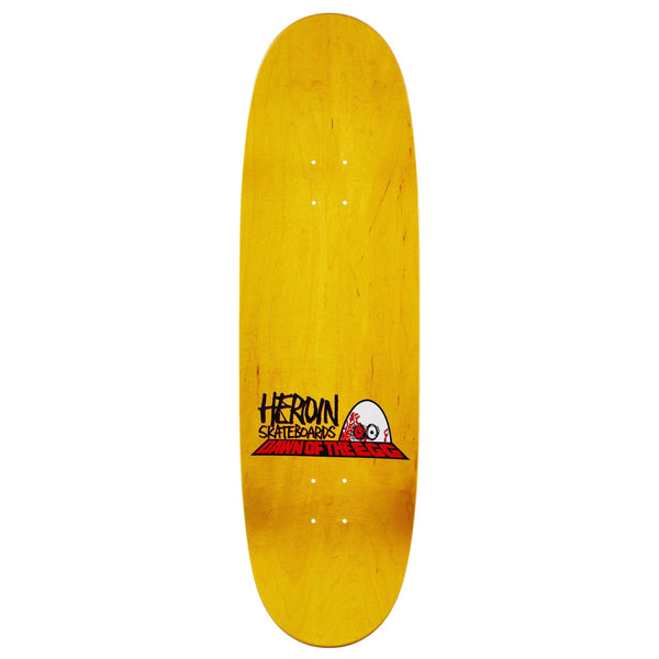The HEROIN DAWN OF THE EGG skateboard deck is yellow, 9.4" wide, made from hard rock maple, and features "Heroin Skateboards Dawn of the Ted" text plus a cartoon skull graphic near the bottom.