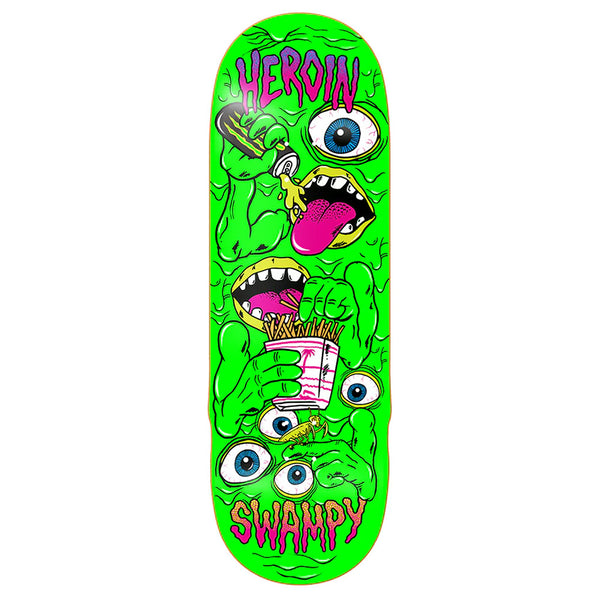 Bright green HEROIN SWAMPY MUTATE OR DIE skateboard deck by HEROIN, featuring cartoon faces with bulging eyes, open mouths, a hand holding fries, and bold pink "HEROIN SWAMPY" text.
