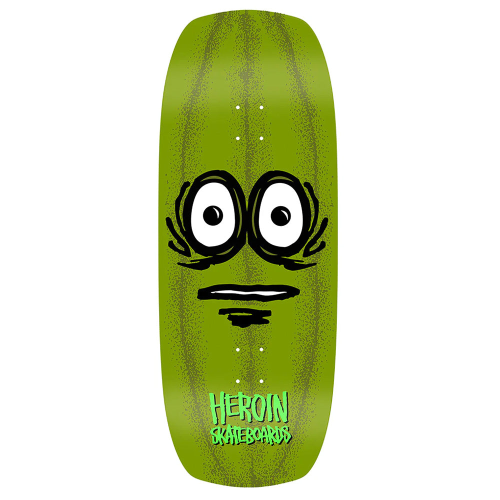 The HEROIN THE PICKLE by HEROIN is a green hard rock maple skateboard deck featuring a cartoon pickle face and "HEROIN SKATEBOARDS" in white at the bottom.