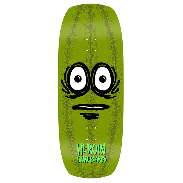 The HEROIN THE PICKLE by HEROIN is a green hard rock maple skateboard deck featuring a cartoon pickle face and "HEROIN SKATEBOARDS" in white at the bottom.