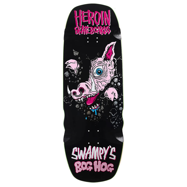 The HEROIN SWAMPY'S BOG HOG by HEROIN is a black North American Hard Rock Maple skateboard deck, featuring a pink cartoon hog breaking through, "Heroin Skateboards" on top, and "HEROIN SWAMPY'S BOG HOG" Razor Edge text at the bottom.