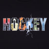 The word "HOCKEY" is printed on a dark background, with each letter filled with different vivid graphics and patterns, including lightning, fire, and nature scenes. Perfect for fans of Hockey Dave's, this HOCKEY DAVE'S ARENA TEE BLACK from HOCKEY makes a bold arena statement.