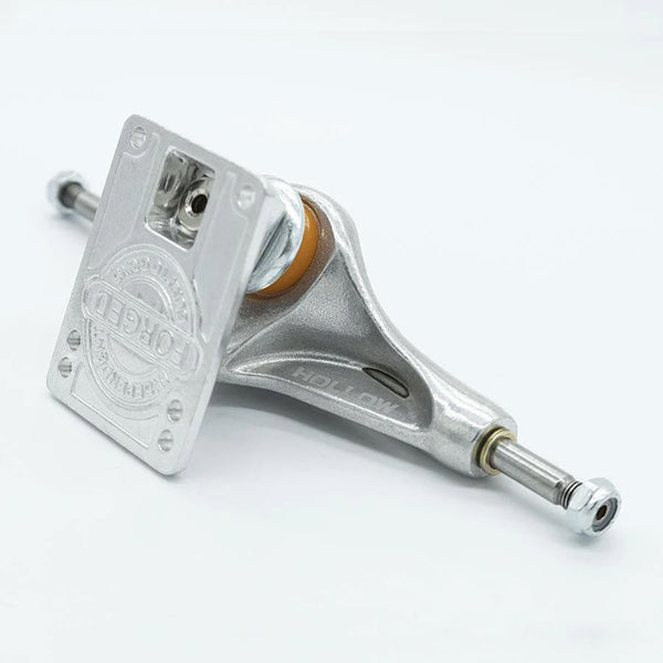 Close-up of the INDEPENDENT FORGED HOLLOW STD 149 TRUCKS, showcasing a hollow hanger design with metal components, orange bushings, and an axle width of 149.