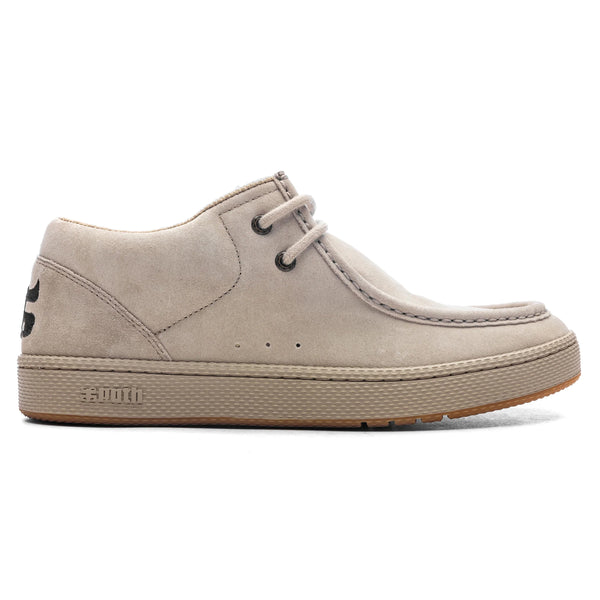 The IPATH CATS TAN SUEDE, a casual shoe by IPATH, boasts a beige suede lace-up design with a thick rubber sole, stitching details, Ortholite insole, and eyelets for laces.