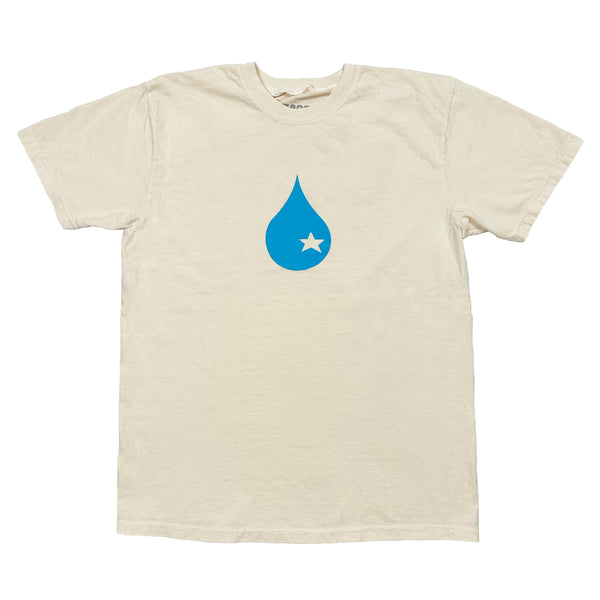A TORO Y MOI X BLUETILE "SANDHILLS" TEE IVORY with a blue water drop on it.