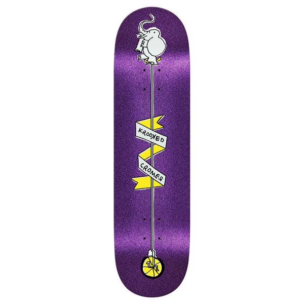 KROOKED's Cromer Unicycle Glitter features a purple skateboard deck with a bird perched on yellow banners reading "Krooked Cromer," designed in a distinctive twin tail shape for ultimate maneuverability.