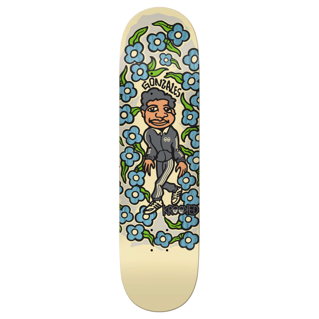 Skateboard deck showcasing a cartoon character amidst blue flowers, adorned with the words "Gonzales" and "Krooked," this stylish piece offers an 8.38" width for optimal balance.