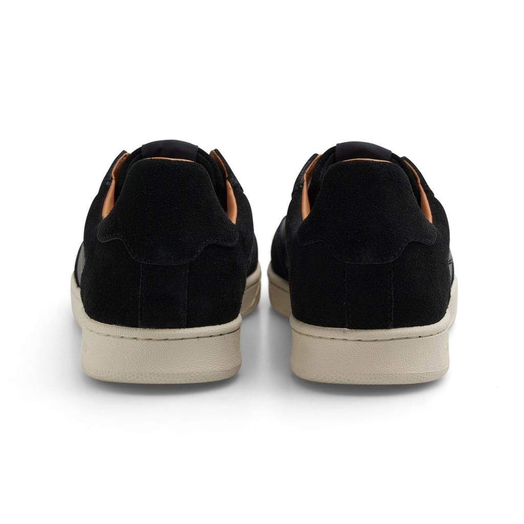 A pair of LAST RESORT AB CM001 BLACK / WHITE sneakers with tan soles.