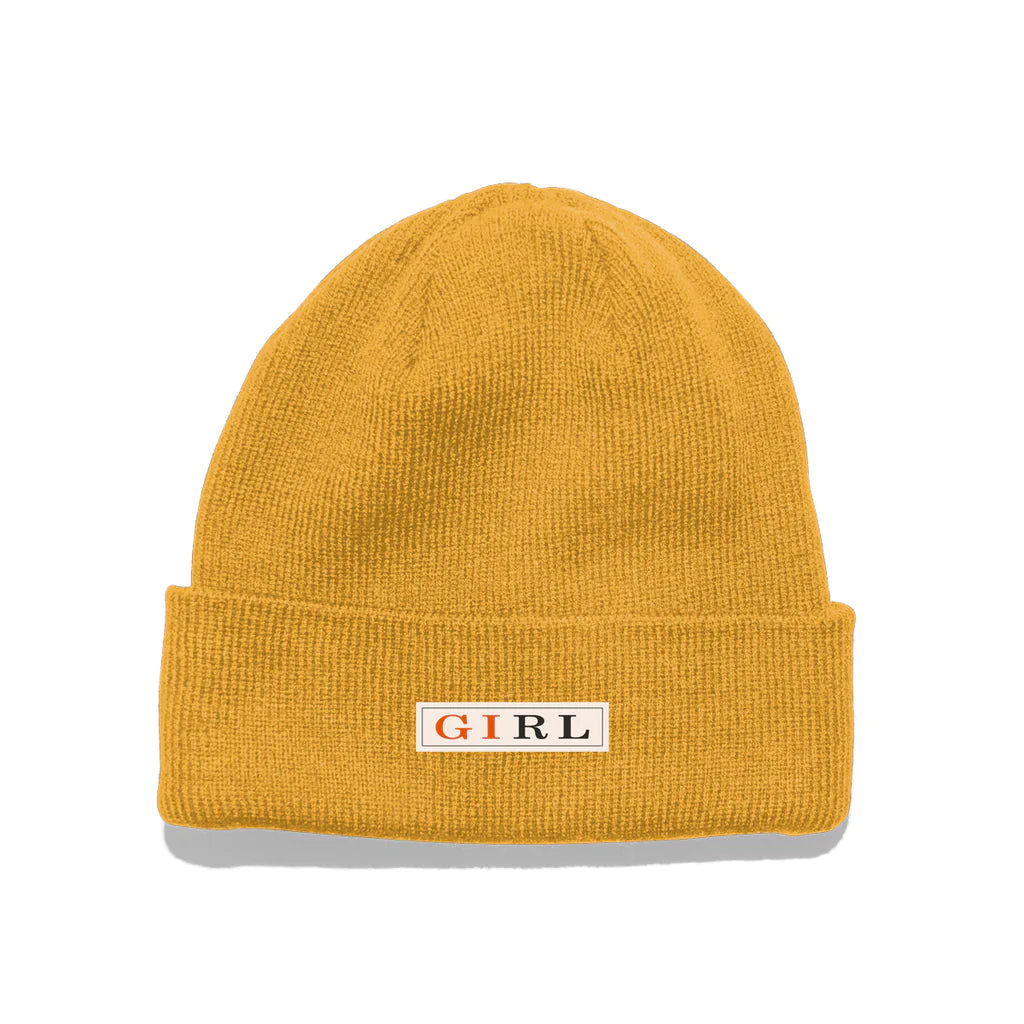A yellow GIRL LETTERPRESS BEANIE GOLD with the word GIRL on it.