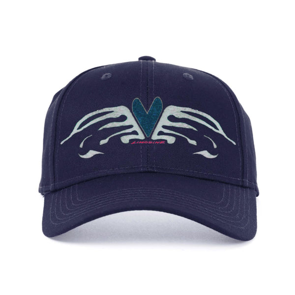 Navy blue LIMOSINE 6 panel hat with a symmetrical limousine heart wings design and a central emblem that resembles a stylized heart, isolated on a white background.