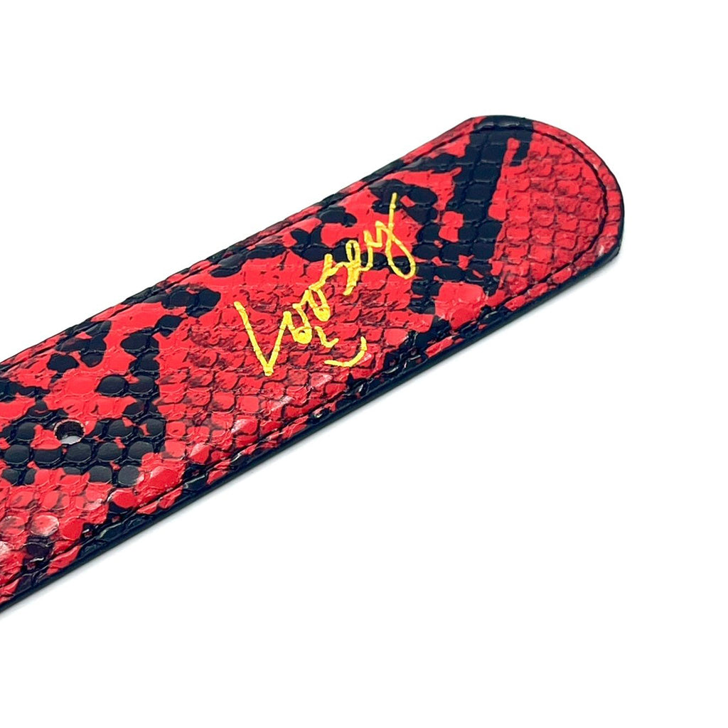 A red and black faux leather snakeskin pen case with a yellow signature design from Loosey, named the LOOSEY SLITHER BELT RED.