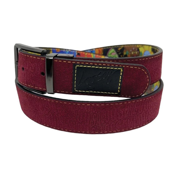 A LOOSEY "TAN MAN" REVERSIBLE BELT by Loosey. The belt is maroon faux leather with a gold buckle and a multi-colored inner lining. It features a black patch with yellow stitching and a cursive design on the surface.