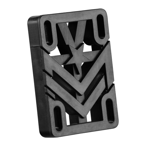 The MINI LOGO .50" RIGID RISER PAD (2 PACK) features a black rectangular design with cutout chevrons, star pattern, and four oval holes near each corner to help prevent wheel bite when using cruiser wheels; shown on a white background.