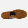 The image shows the sole of a NB NUMERIC sneaker, featuring a textured and patterned rubber outsole in brown with a black central section. The NB NUMERIC 480 WHITE / BLACK / GUM model incorporates an ABZORB in-sole for added comfort.