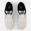 Top view of a pair of NB NUMERIC 480 WHITE / BLACK / GUM sneakers featuring black and white logos on the tongue, "NB NUMERIC 480" written on the sides, and enhanced comfort with ABZORB in-sole.