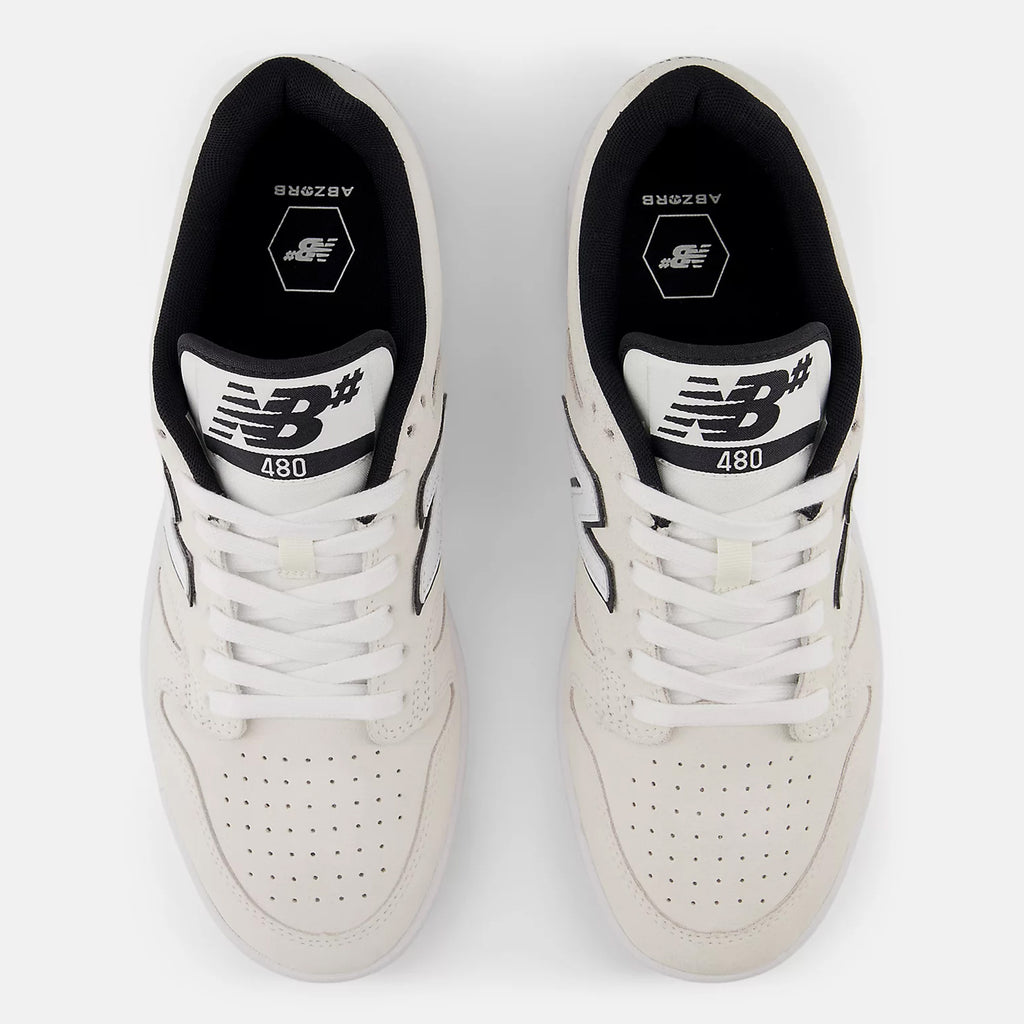 Top view of a pair of NB NUMERIC 480 WHITE / BLACK / GUM sneakers featuring black and white logos on the tongue, "NB NUMERIC 480" written on the sides, and enhanced comfort with ABZORB in-sole.