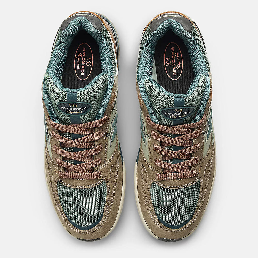 A pair of NB NUMERIC REYNOLDS 933 sneakers in Mushroom/New Spruce, viewed from above, featuring laces, mesh fabric, NB branding on the tongue, and a signature ABZORB midsole for superior comfort.