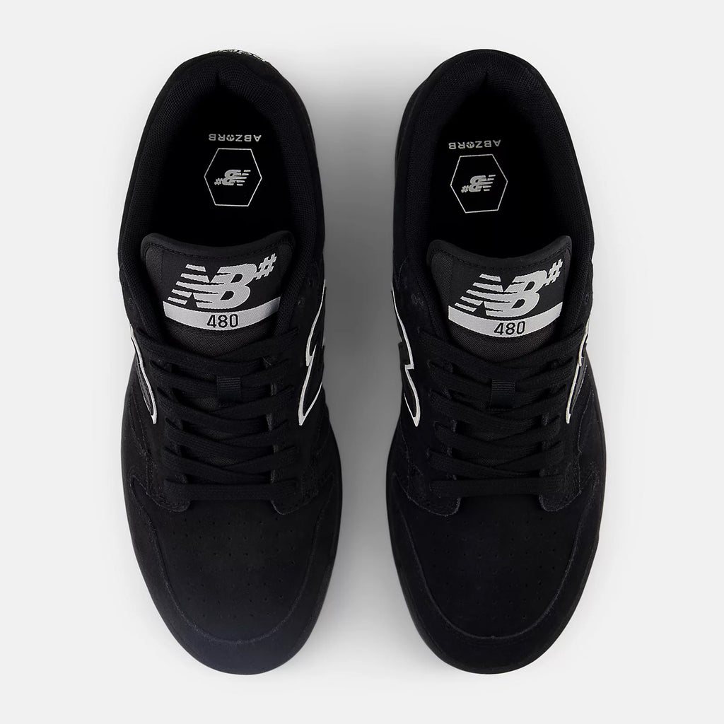 Top view of a pair of NB Numeric NB NUMERIC 480 BLACK / WHITE / GUM sneakers with white detailing on a light grey background.