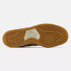 The image displays the bottom sole of an NB Numeric Andrew Reynolds 480 Sea Salt/Brown shoe, showcasing a grooved rubber pattern for traction in tan and beige hues with the New Balance logo in the center. This model also incorporates ABZORB in-sole technology for enhanced comfort.