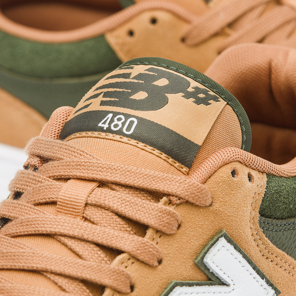 NB Numeric 480 Suede Tan / Green in tan and green, featuring a suede upper.