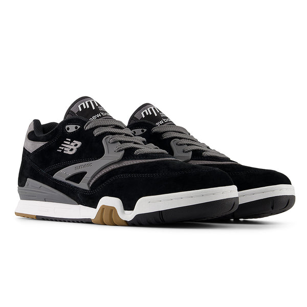 A pair of black NB NUMERIC 770 skate shoes with grey accents, white midsoles, and gum outsoles—featuring FuelCell foam for comfort—side by side on a white background.