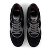 Top view of NB NUMERIC 770 skate shoes in black and grey with grey laces, white soles, and FuelCell foam, placed side by side on a white background.