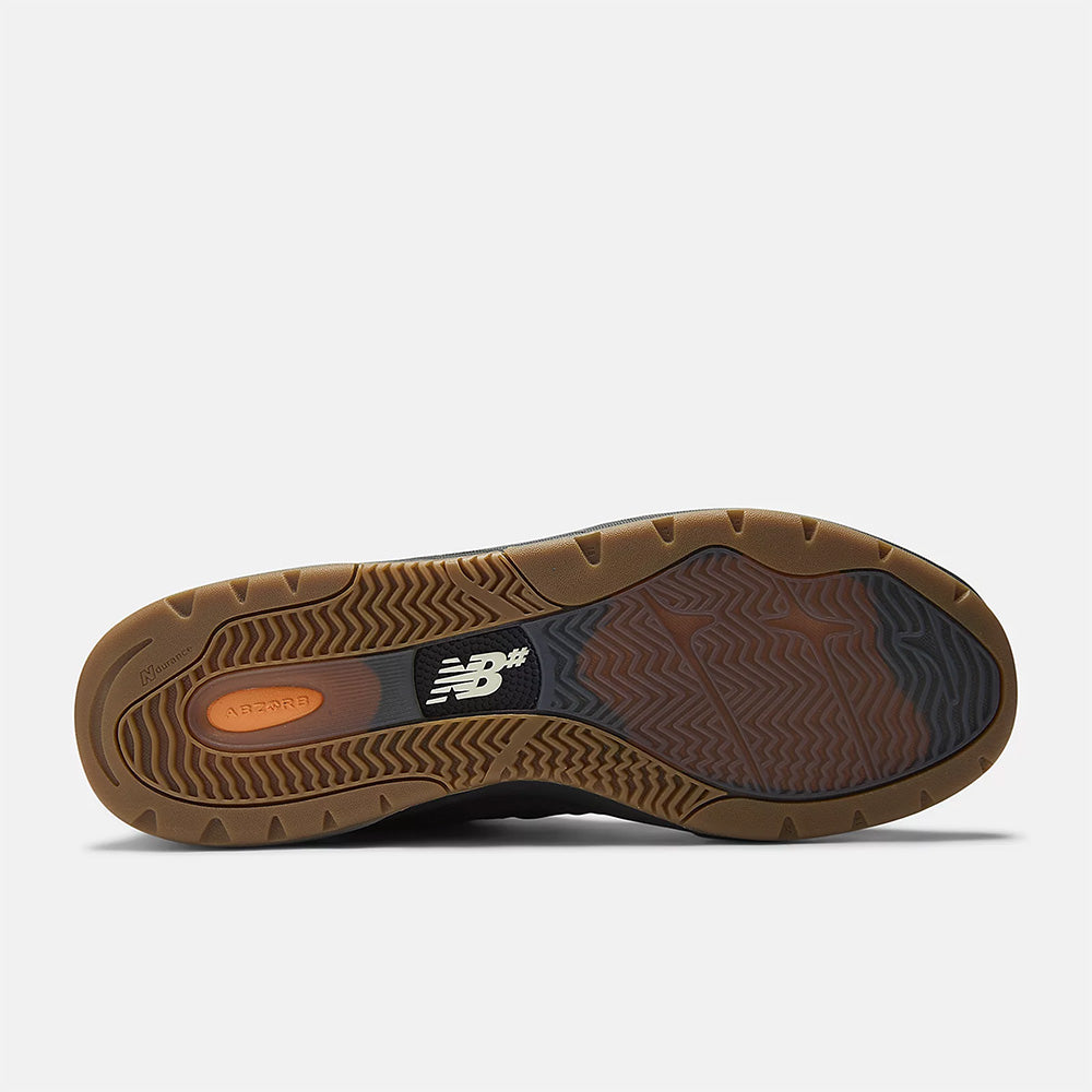 Bottom view of the NB NUMERIC REYNOLDS 933 BROWN / BLACK, showcasing a brown and gum rubber sole with varied textures and the NB Numeric logo—ideal for skate shoes due to its durable grip and ABZORB midsole cushioning.