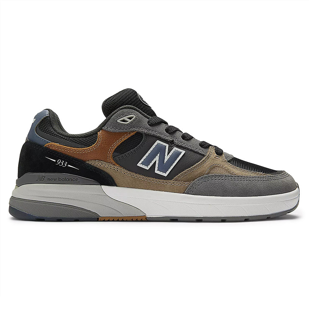 The NB NUMERIC REYNOLDS 933 in Castlerock/Vintage Indigo features a suede and mesh upper, ABZORB midsole for comfort, white midsole, black outsole, and the iconic "N" logo on the side.