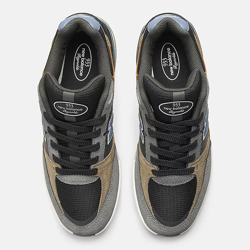 Top view of NB NUMERIC REYNOLDS 933 in Castlerock/Vintage Indigo with black laces, white tongue branding, and an ABZORB midsole for enhanced comfort often desired in skate shoes.