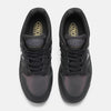 Top view of a pair of NB NUMERIC X BRONZE56K 480 black hightop sneakers with perforated toe boxes, "BROVED" tongue labels, and black laces, photographed against a white background.