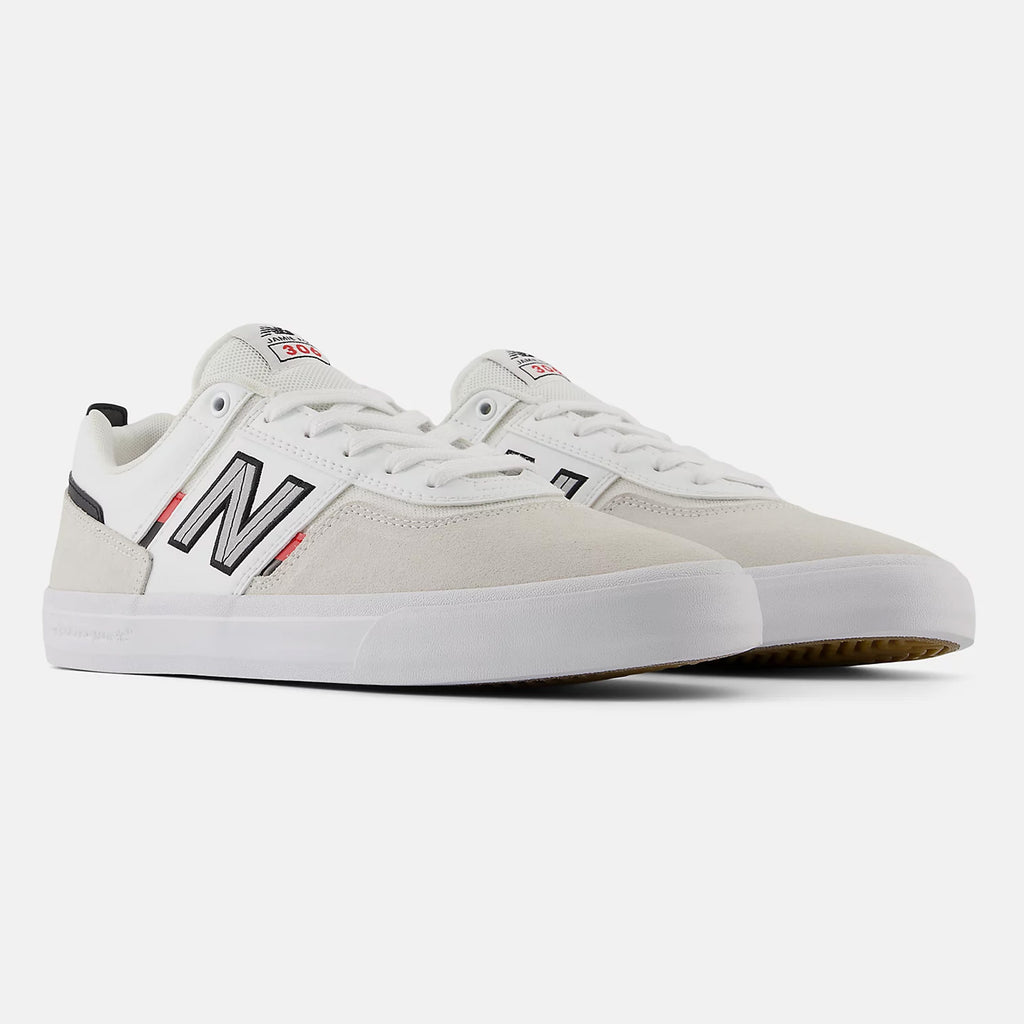 A pair of NB NUMERIC NB NUMERIC FOY 306 WHITE / RED sneakers with black and red accents, featuring the logo "NB" on the side and a white rubber sole - perfect as a durable skate shoe.