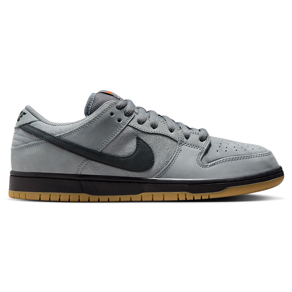 The nike SB Dunk Low Pro Cool Grey/Black features a cool grey upper, black swoosh, grey laces, and a gum sole—shown in side profile on a white background—ideal for fans of stylish skate shoes.